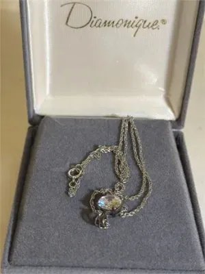 Sale Photo Thumbnail #106: Women's Vintage Diamonique CZ Stone Sterling silver
Women's Vintage Diamonique Sterling silver ZZ stone [ 2.84 g ]   very rare  18 inches chain length
stone is .50"
enclosed in original presentation box