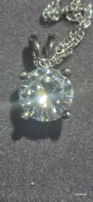 Sale Photo Thumbnail #107: Women's Vintage Diamonique CZ Stone Sterling silver
Women's Vintage Diamonique Sterling silver ZZ stone [ 2.84 g ]   very rare  18 inches chain length
stone is .50"
enclosed in original presentation box