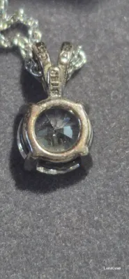 Sale Photo Thumbnail #108: Women's Vintage Diamonique CZ Stone Sterling silver
Women's Vintage Diamonique Sterling silver ZZ stone [ 2.84 g ]   very rare  18 inches chain length
stone is .50"
enclosed in original presentation box
