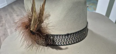 Sale Photo Thumbnail #175: Dynafelft water proof "Stetson Hat" ~ size 7.25
Band and feather are a "yahoo"
Water repellent fur blend is most likely made of wool and rabbit fur blend.
Dynafelft know for top quality line of hats.
There is no sweat on interior, no damage, a small gray 
