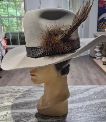 Sale Photo Thumbnail #170: Dynafelft water proof "Stetson Hat" ~ size 7.25
Band and feather are a "yahoo"
Water repellent fur blend is most likely made of wool and rabbit fur blend.
Dynafelft know for top quality line of hats.
There is no sweat on interior, no damage, a small gray 