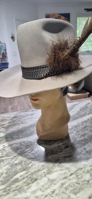 Sale Photo Thumbnail #177: Dynafelft water proof "Stetson Hat" ~ size 7.25
Band and feather are a "yahoo"
Water repellent fur blend is most likely made of wool and rabbit fur blend.
Dynafelft know for top quality line of hats.
There is no sweat on interior, no damage, a small gray 