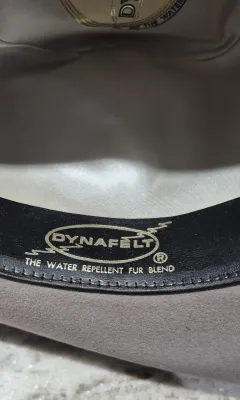Sale Photo Thumbnail #173: Dynafelft water proof "Stetson Hat" ~ size 7.25
Band and feather are a "yahoo"
Water repellent fur blend is most likely made of wool and rabbit fur blend.
Dynafelft know for top quality line of hats.
There is no sweat on interior, no damage, a small gray 
