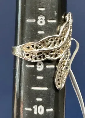 Sale Photo Thumbnail #202: Featuring a diamond cut filigree design, this 925 silver ring shows the popular image of the laurel wreath, which consists of interlocked leaves. Often associated with athletic and academic excellence, the laurel wreath symbolizes victory and greatness. A