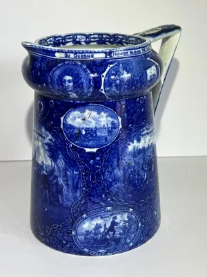 Sale Photo Thumbnail #109: ROWLAND MARSELLUS HISTORICAL POTTERY PITCHER IN BLUE & WHITE WITH VIGNETTES OF VARIOUS HISTORICAL SCENES INCL WILLIAM PENNS TREATY, THE LANDING OF COLUMBUS, ETC. 7-1/2" TALL. $15 DOMESTIC SHIPPING.