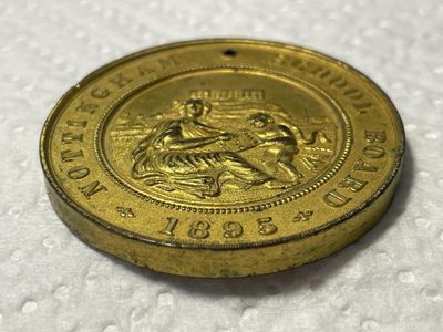 Sale Photo Thumbnail #442: Nottingham School Board Medal 1895 - Exemplary Punctuality Awarded to; F. HUCKNALL Brass Composition as Pictured. (SILVER DOLLAR SIZED MEDAL). $5 DOMESTIC SHIPPING.