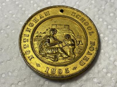 Sale Photo Thumbnail #441: Nottingham School Board Medal 1895 - Exemplary Punctuality Awarded to; F. HUCKNALL Brass Composition as Pictured. (SILVER DOLLAR SIZED MEDAL). $5 DOMESTIC SHIPPING.