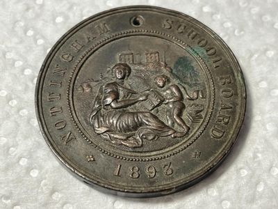 Sale Photo Thumbnail #444: Nottingham School Board Medal 1893 - Exemplary Punctuality Awarded to; F. HUCKNALL Bronze Composition as Pictured. (SILVER DOLLAR SIZED). $5 DOMESTIC SHIPPING.