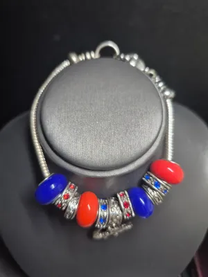 Sale Photo Thumbnail #12: ?University of Florida Gator bracelet for women; like new condition; Pandora-like; 8” in length when unclasped
All original beads and charms.....perfect shape