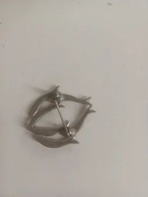 Sale Photo Thumbnail #71: The Dolphin Brooch is a charming and elegant piece of vintage jewelry featuring a dolphin design. , this brooch adds a touch of marine-inspired style to any outfit.
size 2"....pin perfect