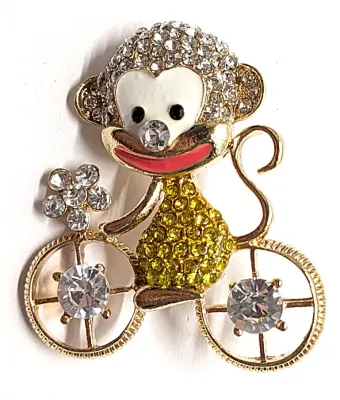 **NEW ARRIVAL** Jeweled "MONKEY ON A BIKE" BROOCH (1½" x 1¼") with Jeweled Body + Big Red Smile and Black Eyes on a...