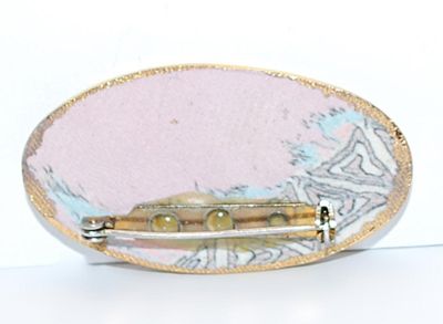 Long OVAL BROOCH (2" x 1") with Pinks & Blues Graphic Design and Gold Colored Edge on a Composite Setting