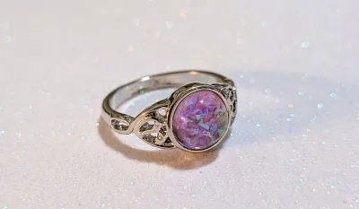 **NEW ARRIVAL** Size 7 Round PINK-ish (Changes Colors) IRIDESCENT STONE RING with a "Split Heart Band" on a Silver Tone Setting...