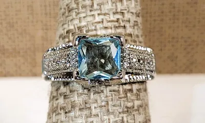 **New Arrival** Size 7¼ Light BLUE Main Transparent Stone RING with Jeweled Side Accents and Enameled Design on a Silver Tone Setting...