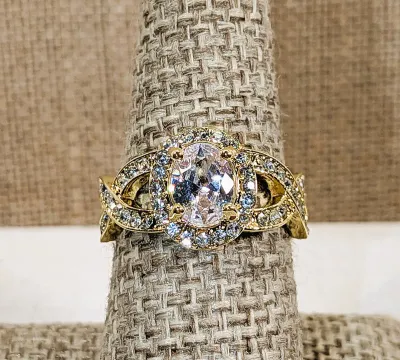 **New Arrival** Size 7¾ Ornate Bejeweled Clear Oval Main Stone RING with Side Loop Accents and Interesting Looped Gold Tone Setting &...