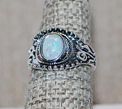 Size 7 Oval Blue Iridescent Opaque Stone RING with Silver Colored Ribbon Surround on a Silver Tone Band (4.4g)