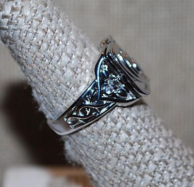 Size 7 "HIDDEN CAMPARTMENT" RING with Single Clear Round Off-Center Stone & Graphic Designed Silver Tone Setting and Band...