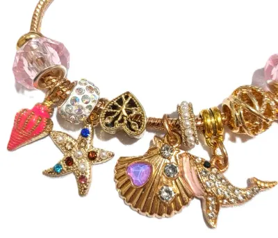 "SEASHORE EXTRAVGANZA" BRACELET with Pink Whale, Lobster, and Seashell; Jeweled Clam and Starfish; Rings of Pearls+Jewels; Gold...