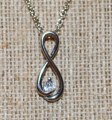 Figure "8" Symbol PENDANT (1" x ½") with a Single Clear Stone Accent on a Silver Tone Necklace Chain 18" L