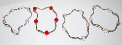 Collection of 4 Curved Wire Elastic BRACELETS (2¼" Opening) with Clear/Red Beads
