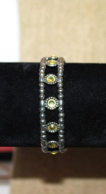 Pretty Yellow Green Round Stones Elastic BRACELET (2¼" Opening) with Silver Tone Globes & Barrels Accent CHAIN