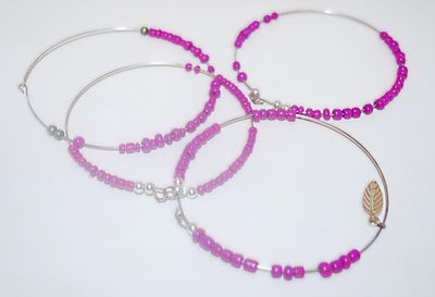 Collection of 4 PINK BANGLE BRACELETS (2¾" Opening) - with MOVEABLE Beads and 1 with LEAF Accent