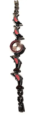 Sale Photo Thumbnail #66: Fun, Interesting DOLPHIN WATCH with Small Pink Surround Dial (¾" Diam.) and Metal Alloy Pink & Silver Colored Dolphins Band, Snap-Over Clasp on a Silver Tone STAINLESS STEEL Case Back**EXTRA BATTERY INCLUDED**

QUARTZ
Non-rechargeable Battery
Brand: ALPH