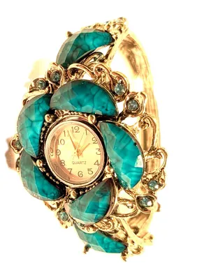 Sale Photo Thumbnail #114: VINTAGE + TURQUOISE STYLE CUFF BANGLE WATCH with BAND: (Silver Color (2½" Opening) Snap-Over Clasp) DIAL: (½" White + Round) BATTERY: Button 20 mm  *EXTRA BATTERY INCL.*
NOTE: Band has Tarnish/"Rust Spot"
ALL ITEMS SHIPPED FREE