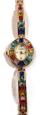 Sale Photo Thumbnail #138: MULTICOLOR JEWELED OVAL WATCH with BAND: (Jeweled, Gold Color 7" Snap-Over Clasp) DIAL: (¼" Jeweled, White + Oval) BATTERY: Button 20 mm  *EXTRA BATTERY INCL.*
ALL ITEMS SHIPPED FREE