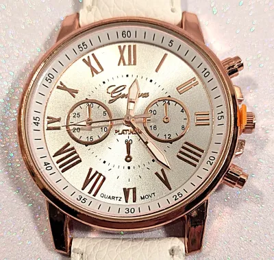 Sale Photo Thumbnail #208: WHITE Double Dials WATCH + Luminescent Hands-BAND: (White 9" Faux Leather) DIAL: (1½" White, Round, Rose Gold Edge) BRAND: (Geneva) BATTERY: Button 20 mm  *EXTRA BATTERY INCL.*
ALL ITEMS SHIPPED FREE