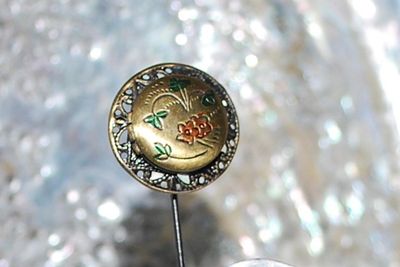 Round Flowered EMBLEM FLOWER PIN (2½" L) with Swirled Surround on a Brass-Style Tone Setting