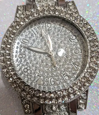 Sale Photo Thumbnail #261: Silver Colored VERY JEWELED BAND & DIAL WATCH with BAND: (Jeweled Clear Stones Segments 8") DIAL: (1¼" Silver Tone with Jeweled Surround + Round) BATTERY: Button 20 mm  *EXTRA BATTERY INCL.*
ALL ITEMS SHIPPED FREE