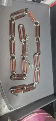 Sale Photo Thumbnail #240: Original 1960-70s Chain Link Waist Belt, Faux Tortoise Shell Lucite and Brass
Made of acrylic/lucite and brass

Full length (end to end) is 42 inches

Clasp works fine, no broken pieces or anything. 

Original, from the 1960-70s