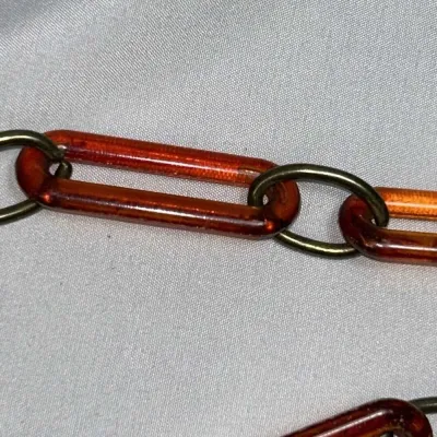 Sale Photo Thumbnail #238: Original 1960-70s Chain Link Waist Belt, Faux Tortoise Shell Lucite and Brass
Made of acrylic/lucite and brass

Full length (end to end) is 42 inches

Clasp works fine, no broken pieces or anything. 

Original, from the 1960-70s