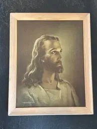 Vintage framed print of Warner Sallman's "Head of Christ" in a simple light wood frame.