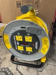 Masterplug 50-foot open cable reel with four integrated outlets, a power switch, and a carrying handle.