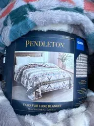 Pendleton queen-size faux fur luxe blanket, new in original packaging.