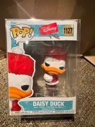 Funko Pop! Disney Daisy Duck vinyl figure #1127, holiday edition, in its original box with a protective plastic sleeve.
