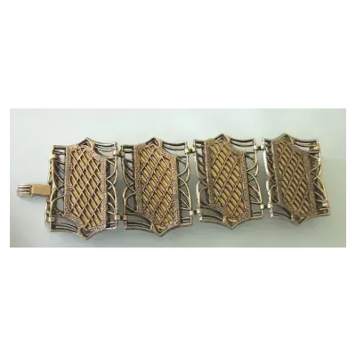 Sale Photo Thumbnail #222: Wonderful very wide 4 section bracelet featuring bold swirl lucite faux tortoise set in bronze tone metal. The bracelet is finished with a foldover clasp.

The bracelet is 2-1/4" wide by 7-1/2" wide. Because it is so chunky, it will likely wear like a 7-1