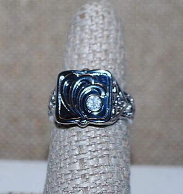 Size 7 "HIDDEN CAMPARTMENT" RING with Single Clear Round Off-Center Stone & Graphic Designed Silver Tone Setting and Band...