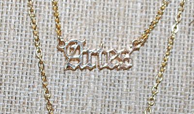 Collection of 2 ZODIAK SIGN - "ARIES" NECKLACES - one with the Word and the other with the Constellation - both in Gold Tone...