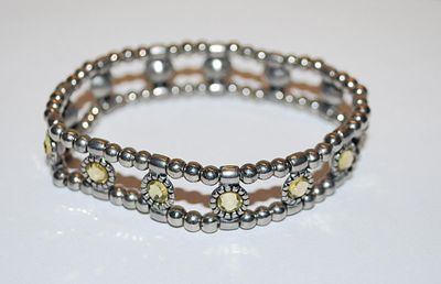 Pretty Yellow Green Round Stones Elastic BRACELET (2¼" Opening) with Silver Tone Globes & Barrels Accent CHAIN