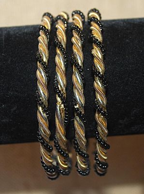 Collection of 4 Twisted IDENTICAL BRACELETS (2½" Opening) in Black, Gold & Silver Tones