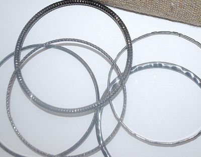 Collection of 5 Black BANGLE BRACELETS (2½" Opening) with Assorted Finishes