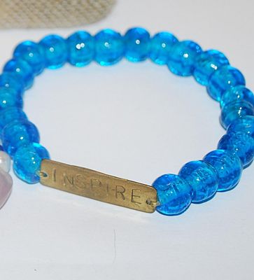Collection of 3 BRACELETS (2½" Opening) with "INSPIRE" Accent, "Buddha Head" and 1 with Toggle Clasp