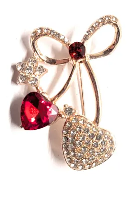 **NEW ARRIVAL** Bejeweled RED & JEWELED HEARTS BROOCH (1½" x 1") with Jeweled Bow and Star Accents on a Rose Gold Tone Setting
