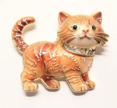 **NEW ARRIVAL** VERY ORANGE ENAMELED KITTEN BROOCH (1¾" x 1½") with Jeweled Collar, Green Eyes and Striped Tail on a Gold Tone...