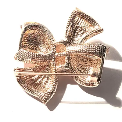 **NEW ARRIVAL** ROSE GOLD BOWTIE KNOT BROOCH (1½" x 1½") with Jeweld Round Accent Stones on a ROSE GOLD Tone Setting