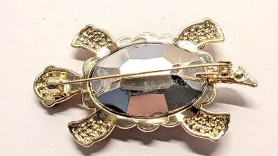 **NEW ARRIVAL** TURTLE BROOCH (2¼" x 1½") with RED Body Stones, Black Eyes and Iridescent Stones Shell Surround on a Gold Tone...