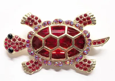 **NEW ARRIVAL** TURTLE BROOCH (2¼" x 1½") with RED Body Stones, Black Eyes and Iridescent Stones Shell Surround on a Gold Tone...